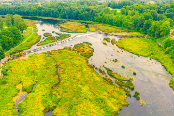 Beautiful panoramic aerial view photo from flying drone to Venta Rapid waterfall,the widest...