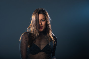 Sexy closeup portrait of young female model looking at the camera