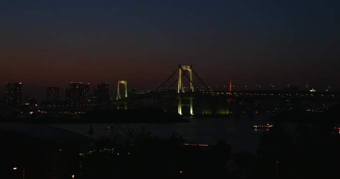 The Odaiba Harbor at Night, in Tokyo, with the Rainbow Bridge. End of a stressful day in the city that never sleeps 4K