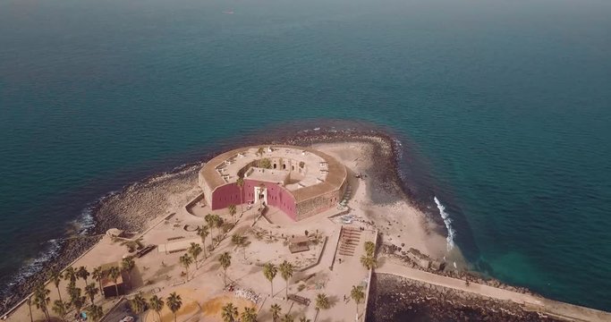 the island gore from which slaves were exported from Africa, turquoise water and yellow sand photographed from the air