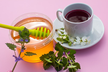 A Cup with a drink and honey. Treatment and prevention of the disease morning Breakfast.