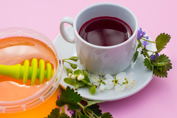 A Cup with a drink and honey. Treatment and prevention of the disease morning Breakfast.