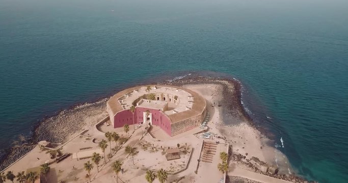 the island gore from which slaves were exported from Africa, turquoise water and yellow sand photographed from the air