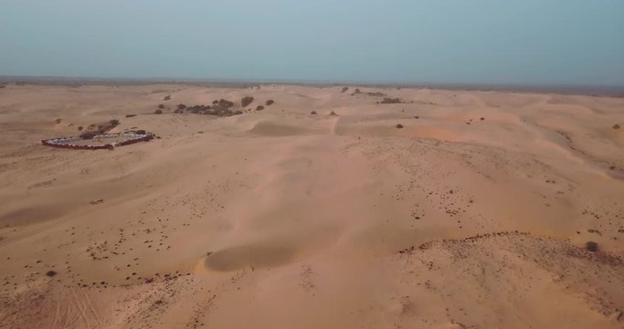 lompoul desert yellow sand photographed from the air in Africa camels and drivers go by caravan in Africa