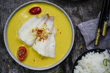 Steamed Fish Flounder in soy sauce and Curry saffron sauce, top view