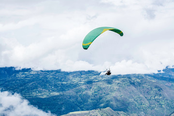 people practicing paragliding and flying through the sky on vacations