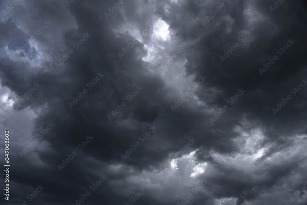 Wall mural terrible thunderclouds from the side of a plane. gloomy epic clouds. background image in a dark gray