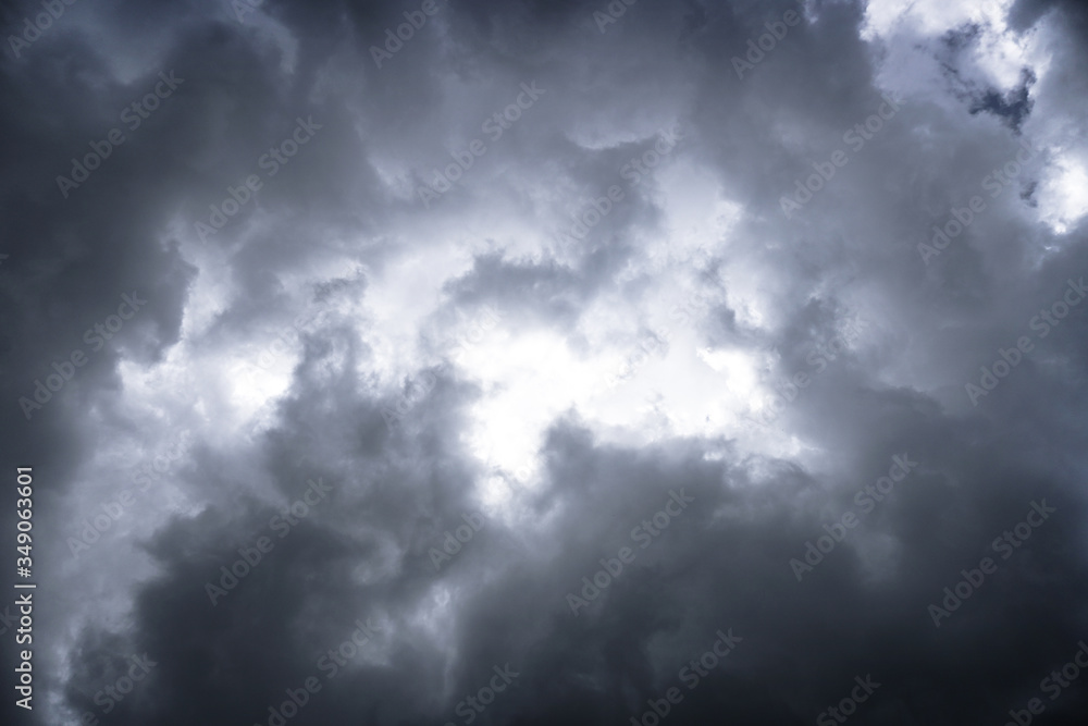Wall mural terrible thunderclouds from the side of a plane. gloomy epic clouds. background image in a dark gray
