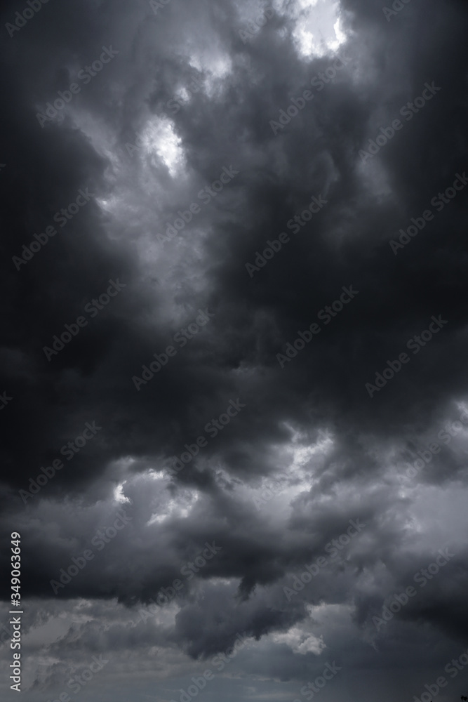 Wall mural terrible thunderclouds from the side of a plane. gloomy epic clouds. background image in a dark gray