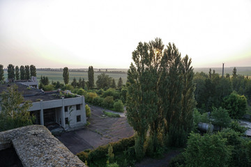 Ruins of abandoned buildings in 1986. Soviet architecture in Chernobyl. Danger of infection of...
