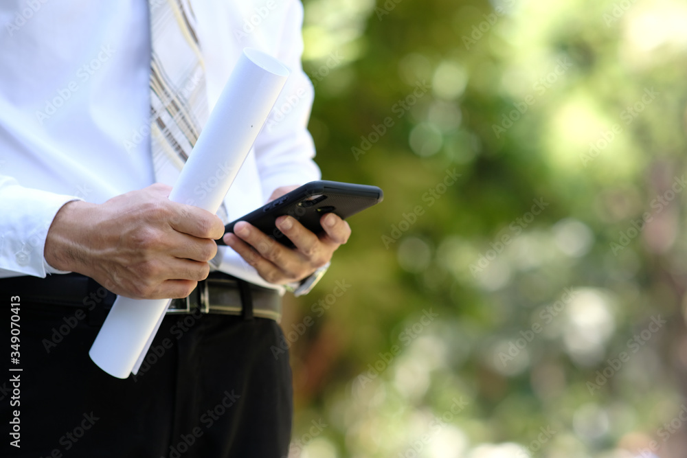 Poster close up businessman using a smartphone and space for text