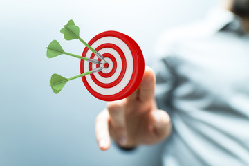 makes a dart throw on the target. The concept of persistence in business..