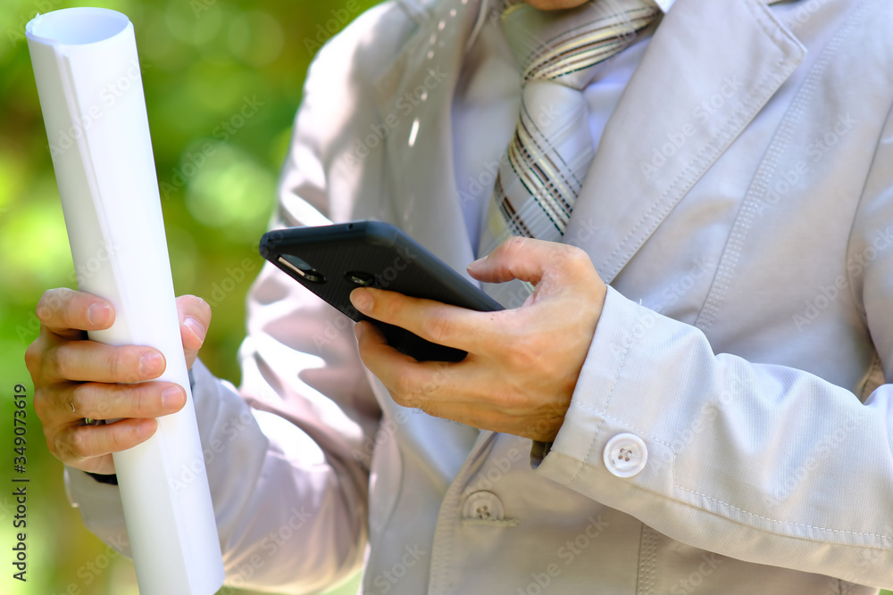 Poster businessman using a smartphone and space for text