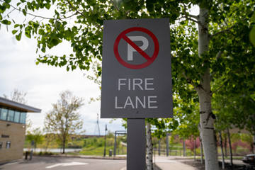 No Parking - Fire Lane sign preventing cars from blocking emegency exits