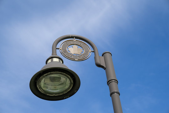 Maple Grove, Minnesota - May 14, 2020: Lamp Post With The City Of Maple Grove Logo. This Is A Northwestern Suburb Of The Minneapolis Twin Cities Area