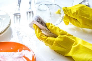 concept of woman washing dishes on white background