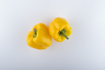 fresh yellow bell peppers close-up on a white background