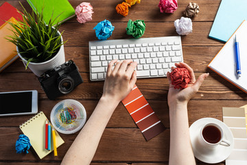 Close up woman hands with colorful paper balls