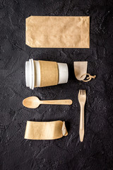 breakfast take away with paper bags on dark table background top view mock up