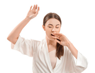 Tired young woman on white background