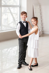 Cute little children dancing in studio