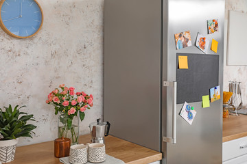 Big modern refrigerator in kitchen