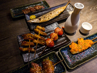 Set of delicious traditional skewers grilled and fish dinner restaurant.