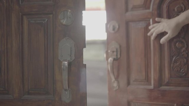 Men's hand open the door home close up. Slog3.