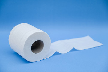 Toilet paper isolated on a blue background