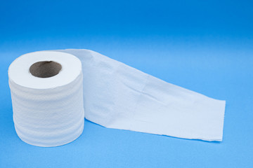 Toilet paper isolated on a blue background