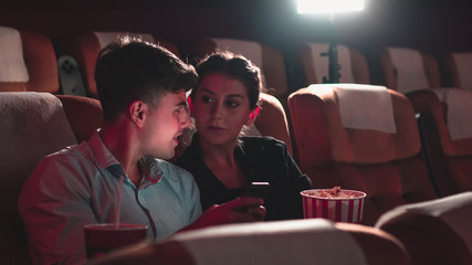 Men playing games on mobile phones he makes his girlfriend annoy and Interfere with watching the...
