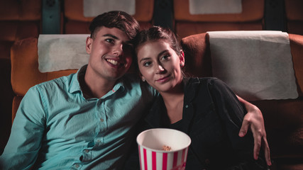 People audience watching movie in the movie theater cinema. Group recreation activity and...