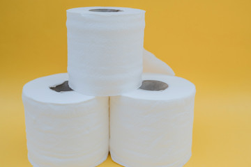 Toilet paper isolated on a yellow background