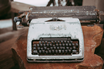 Old typewriter on wood table,vintage style.