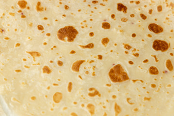 Pancake texture top view. Pancake surface. Abstract background close-up, shallow depth of field, copy space.
