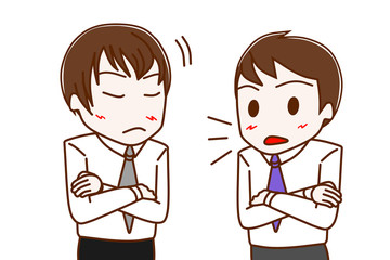 真剣に話す会社員の男性と納得する会社員の男性