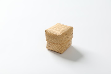 steamed sticky rice is in bamboo container
