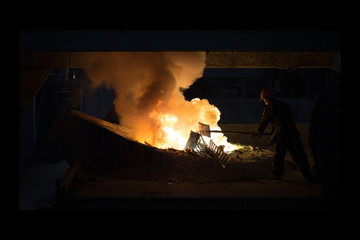 Smelting metal in a metallurgical plant.