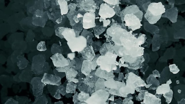 Super Slow Motion of exploding crushed ice towards camera, close-up, 1000 fps.
