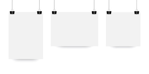 The sheet hangs on the clip. White paper poster in mocap style. A vector template of a suspended light sheet of paper. Stock Photo.