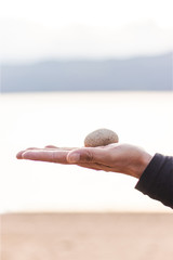 hand holding therapy stone