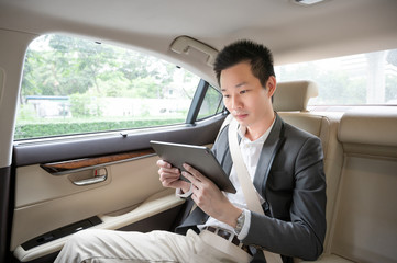 Handsome asian businessman working with tablet. Young executive manager Full concentration at work...