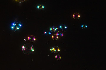 Soap bubbles isolated on a black background. Copy space.