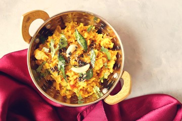 Dal khichadi/Masala Khichdi/daal khichdi tadka is a healthy Indian recipe made of mixed Lentils & rice combined with spices & vegetables. Served with Curd or Yogurt, Papad & chili pickle. Copy Space