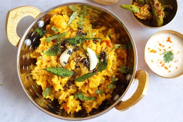 Dal khichadi/Masala Khichdi/daal khichdi tadka is a healthy Indian recipe made of mixed Lentils & rice combined with spices & vegetables. Served with Curd or Yogurt, Papad & chili pickle. Copy Space