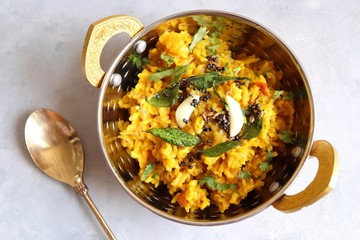 Dal khichadi/Masala Khichdi/daal khichdi tadka is a healthy Indian recipe made of mixed Lentils & rice combined with spices & vegetables. Served with Curd or Yogurt, Papad & chili pickle. Copy Space