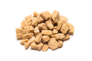 Brown sugar pieces isolated on white