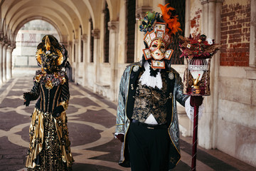 Portrait of a couple with beautiful masks in Venice, Italy