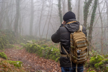hiker in the woods and fog