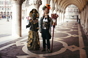 Portrait of a couple with beautiful masks in Venice, Italy